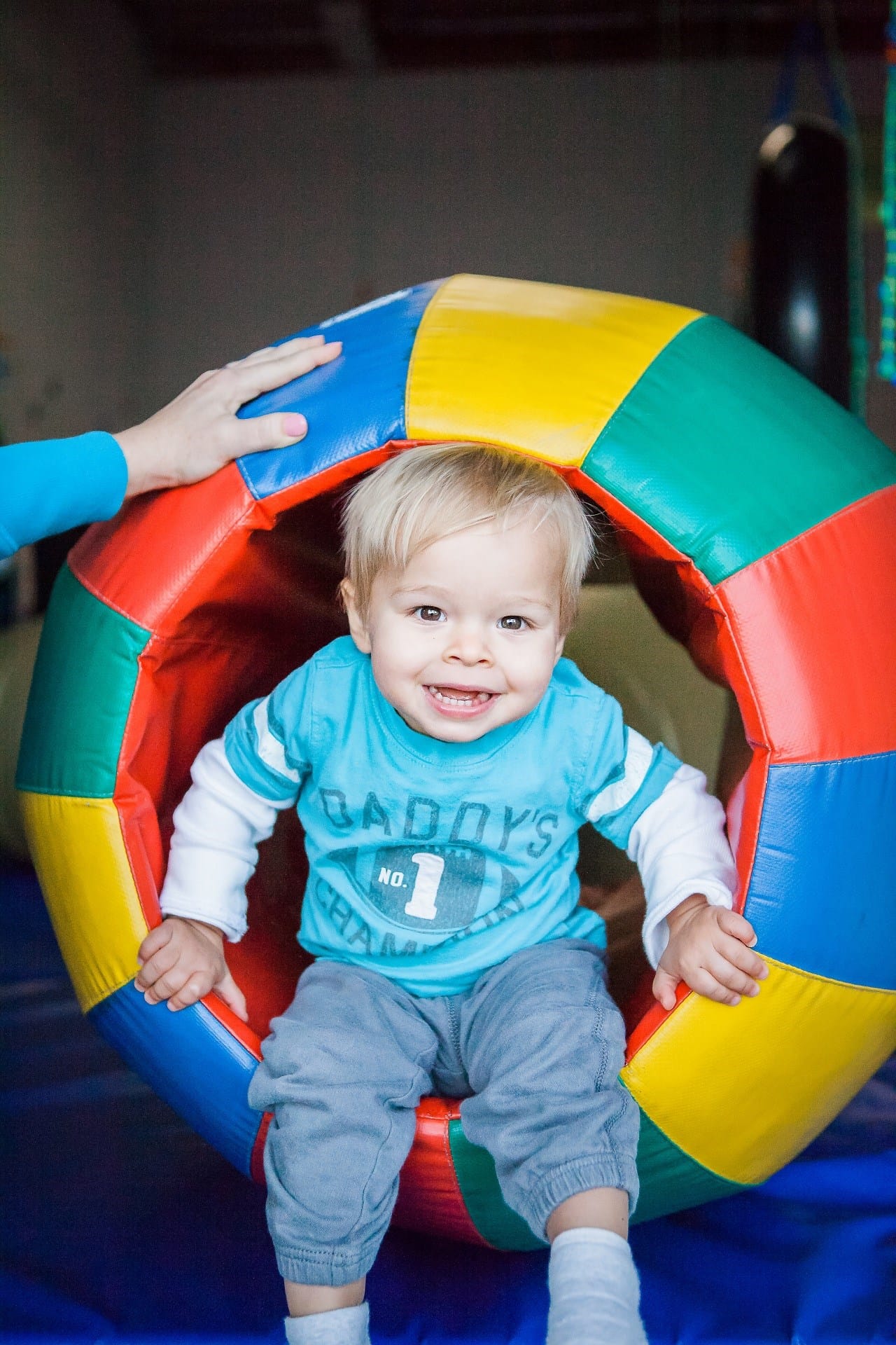 IMG_4147-Edit_print Child sitting inside foam therapy barrel.