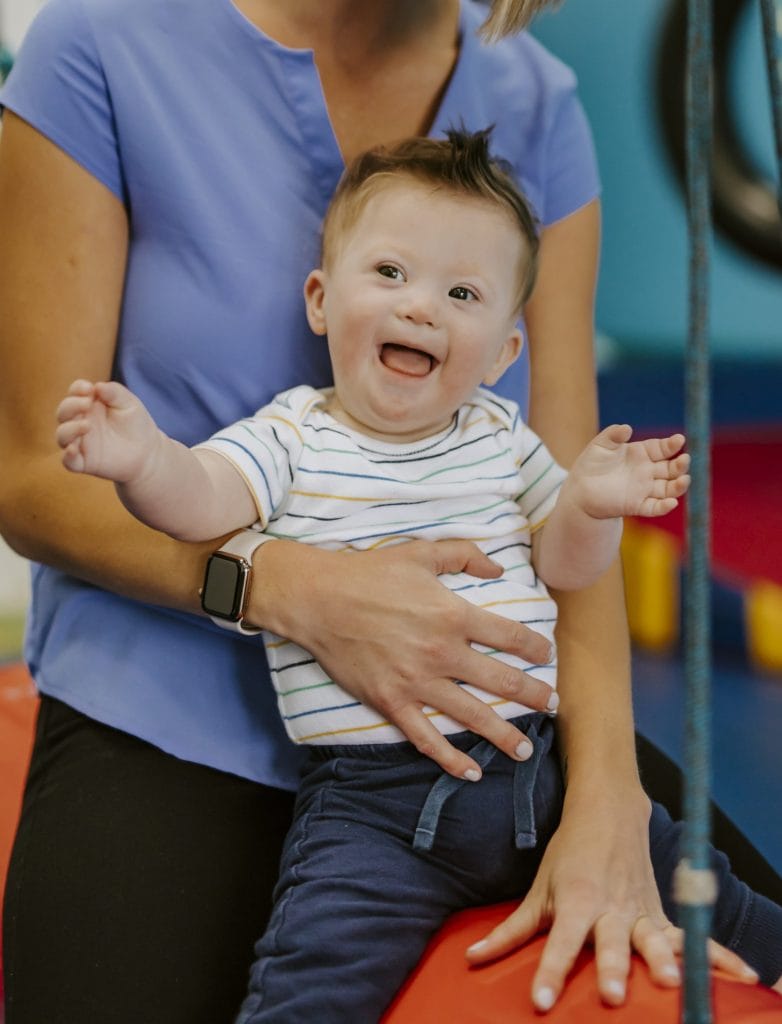 Welcome to SDOT! Child climbing up roller slide.